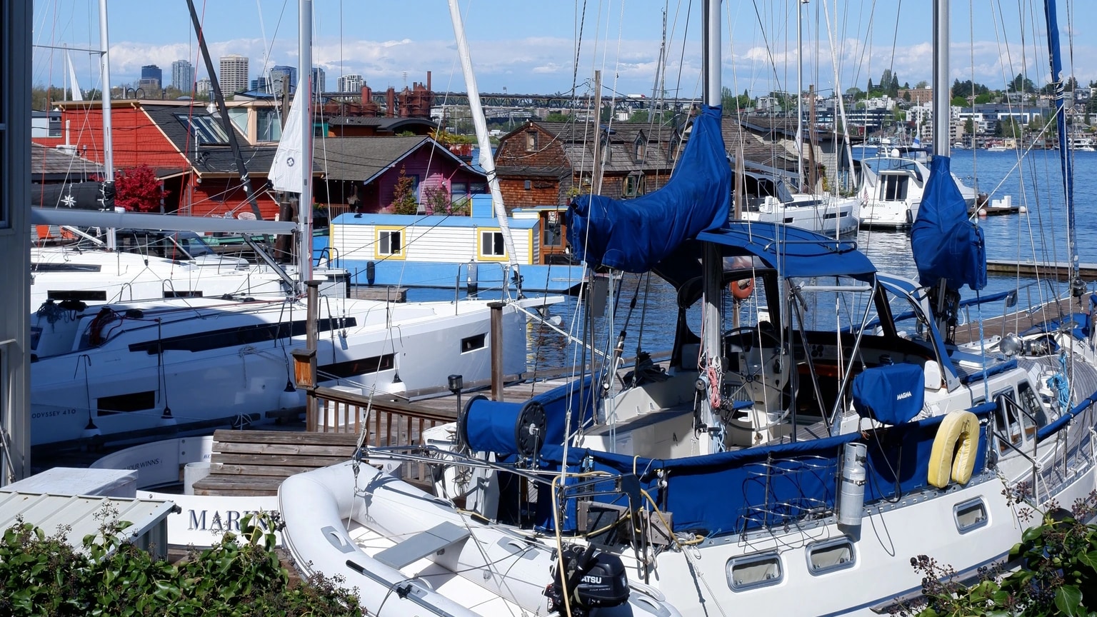 Used cruising sailboats lie closely packed in a marina