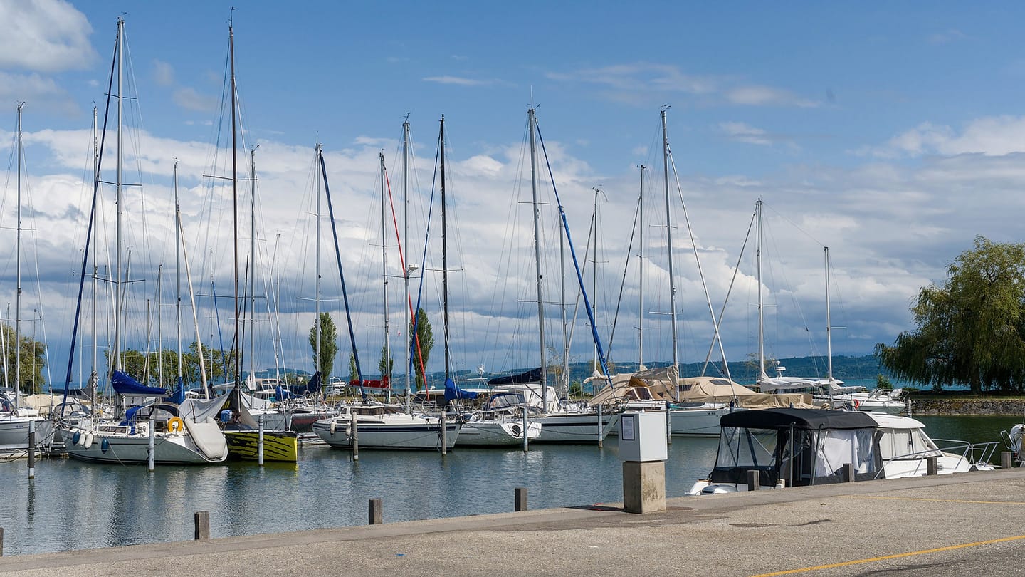 Sailboats sit in a marina where crews can prepare before going afloat.