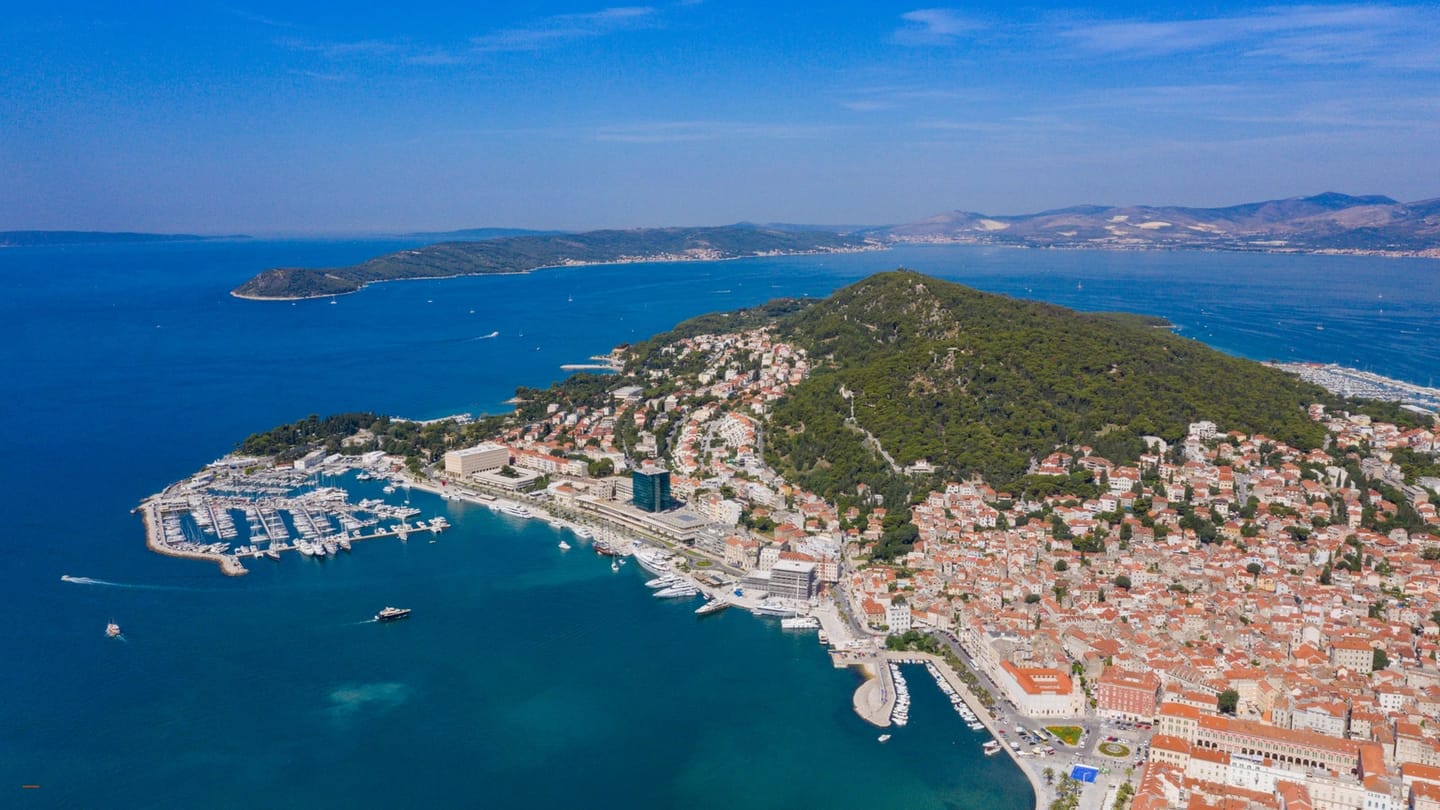 Aerial view of sailboats and waterfront buildings at Split marina in Croatia