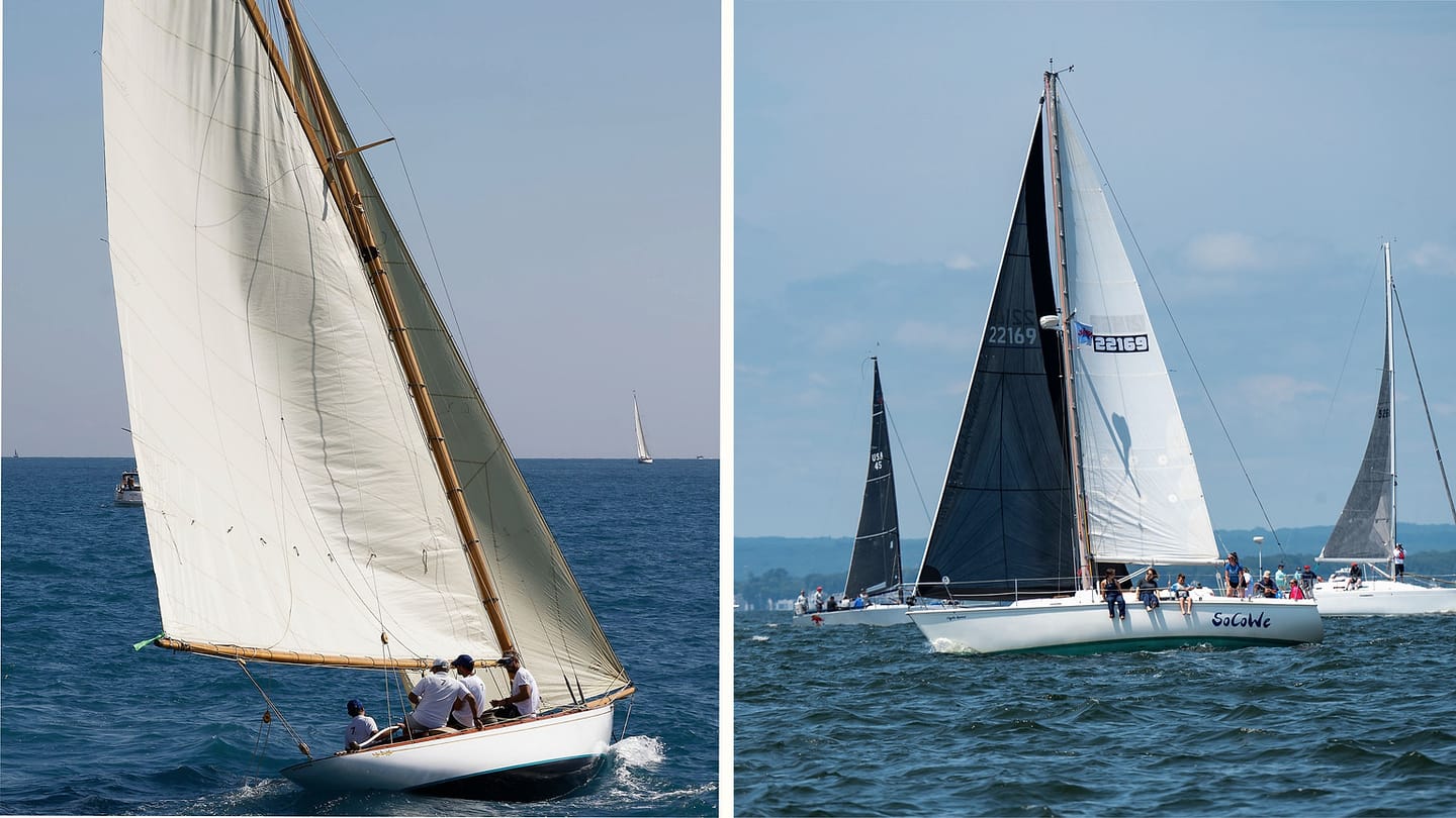 Cruising sailboat and racing fleet on open water