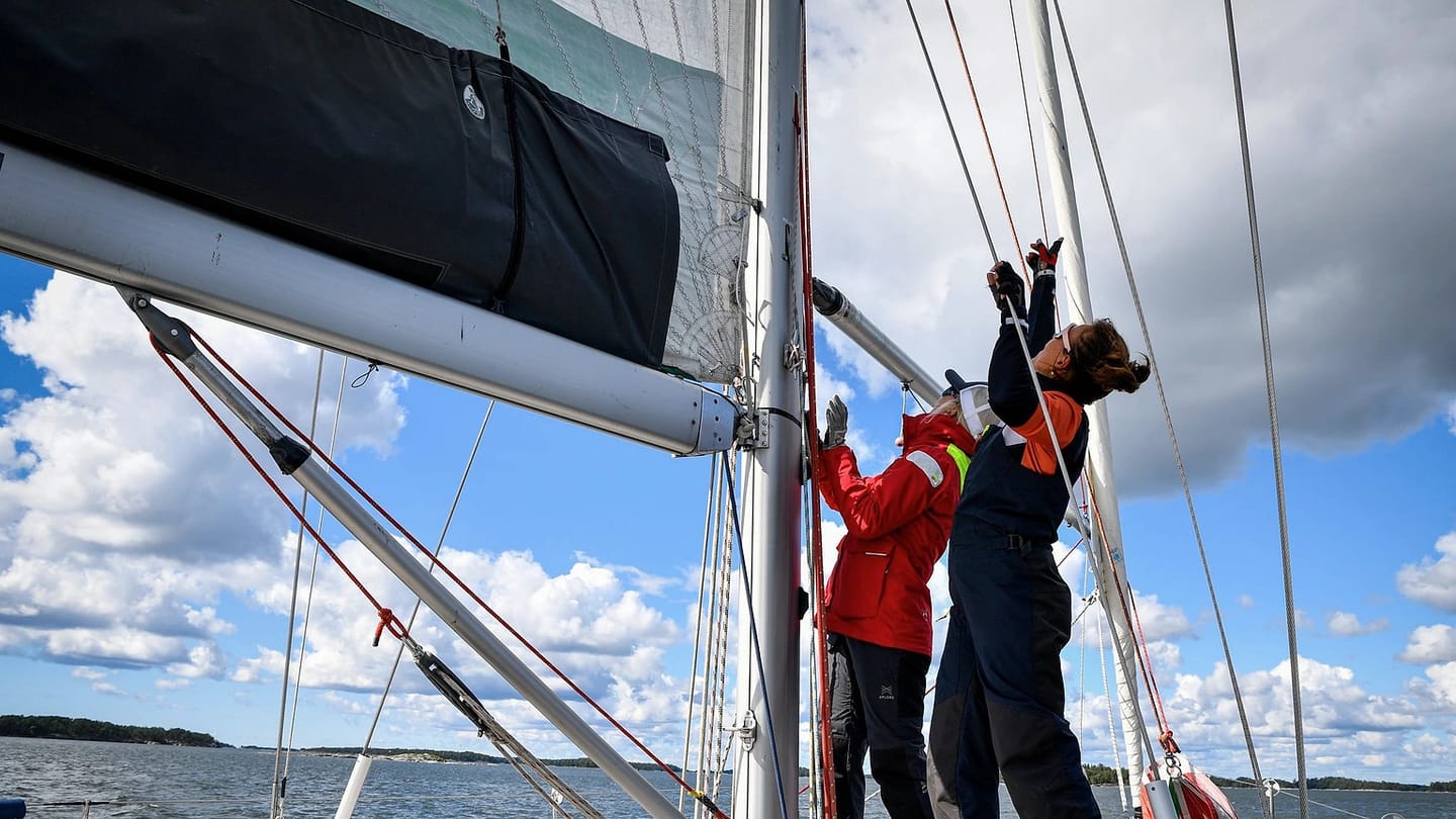 Sailing crew working together on open water