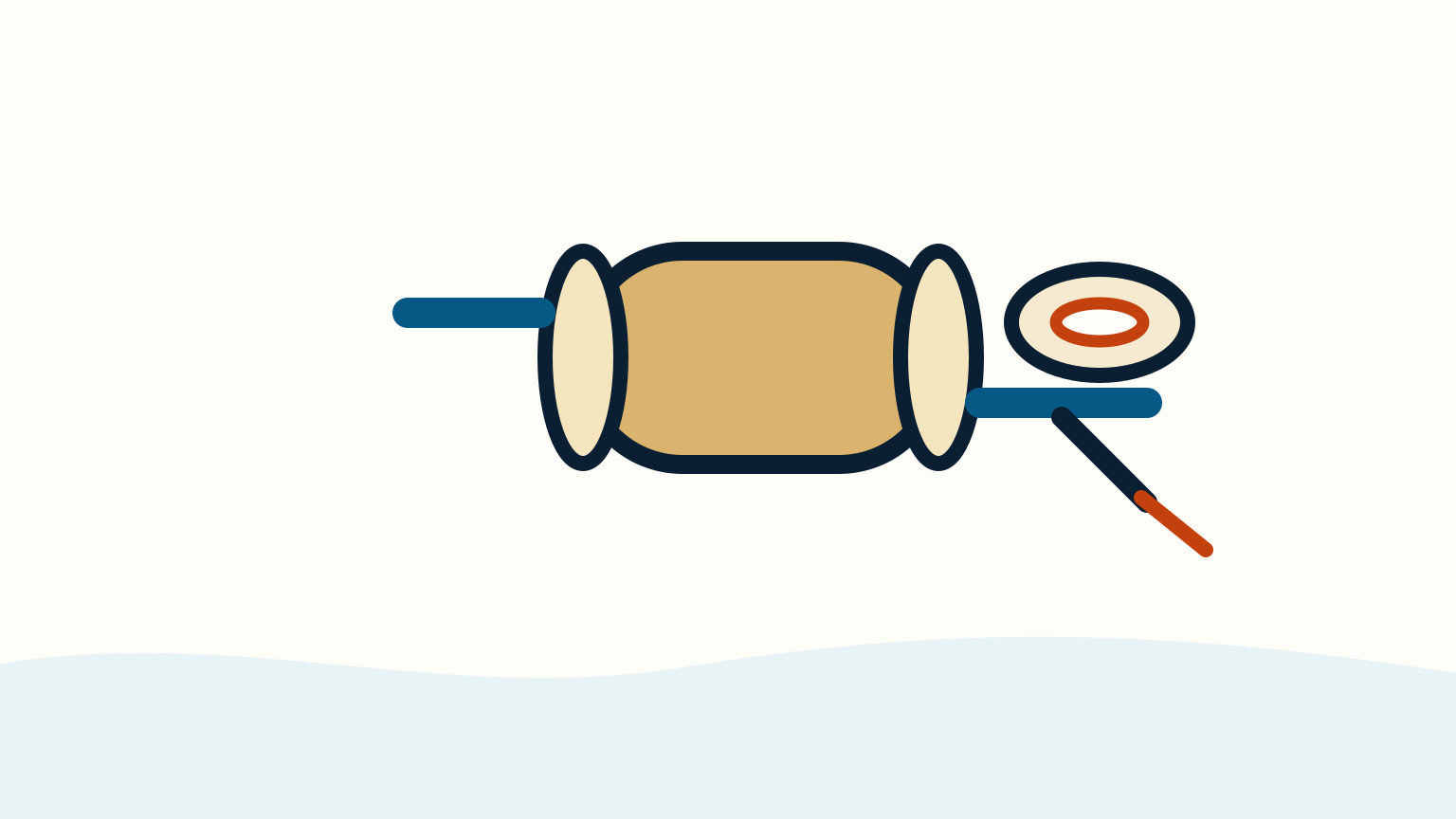 A circular orange gasket and a grey wrench sit beside a brass heat exchanger