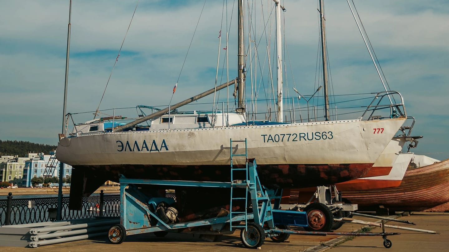 Sailboat standing ashore with its hull visible