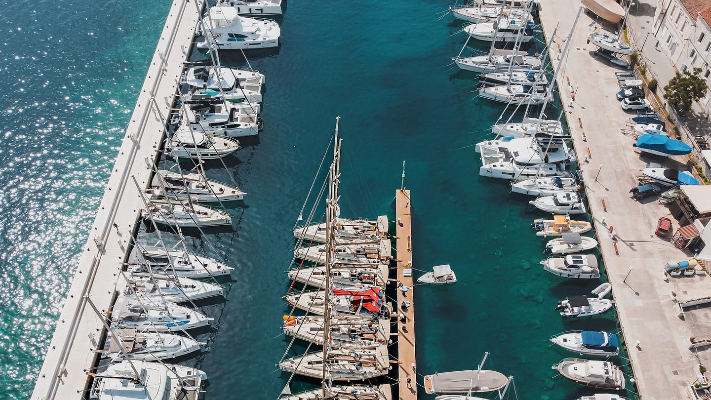 An aerial marina view shows why a stopping plan needs room and an escape route.
