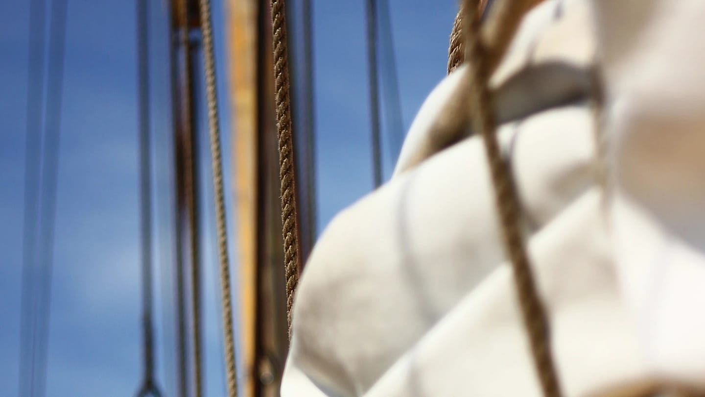 Folded sailcloth and rigging viewed from below