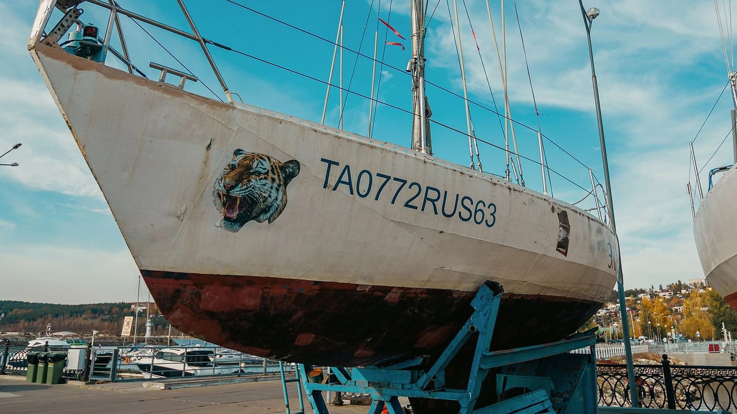 Sailboat stored ashore in a working boatyard