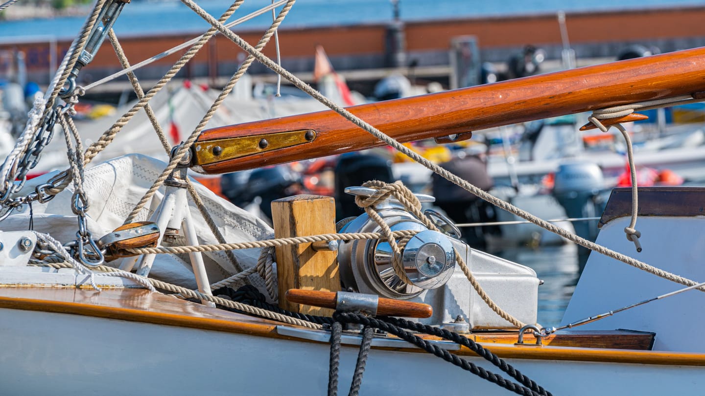 Jib sheets and deck hardware beside the cockpit of a sailboat