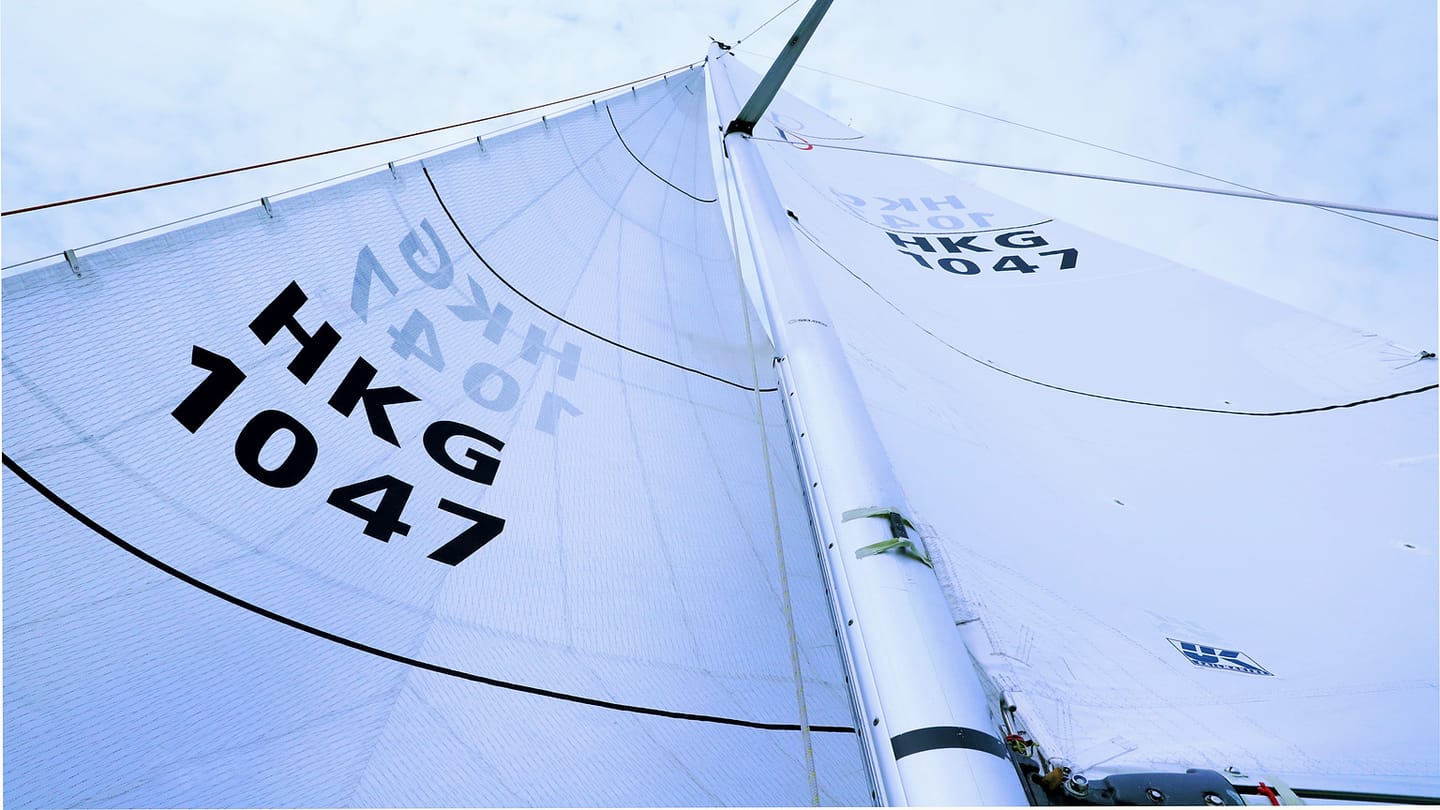 Close view of a large white sail and rig