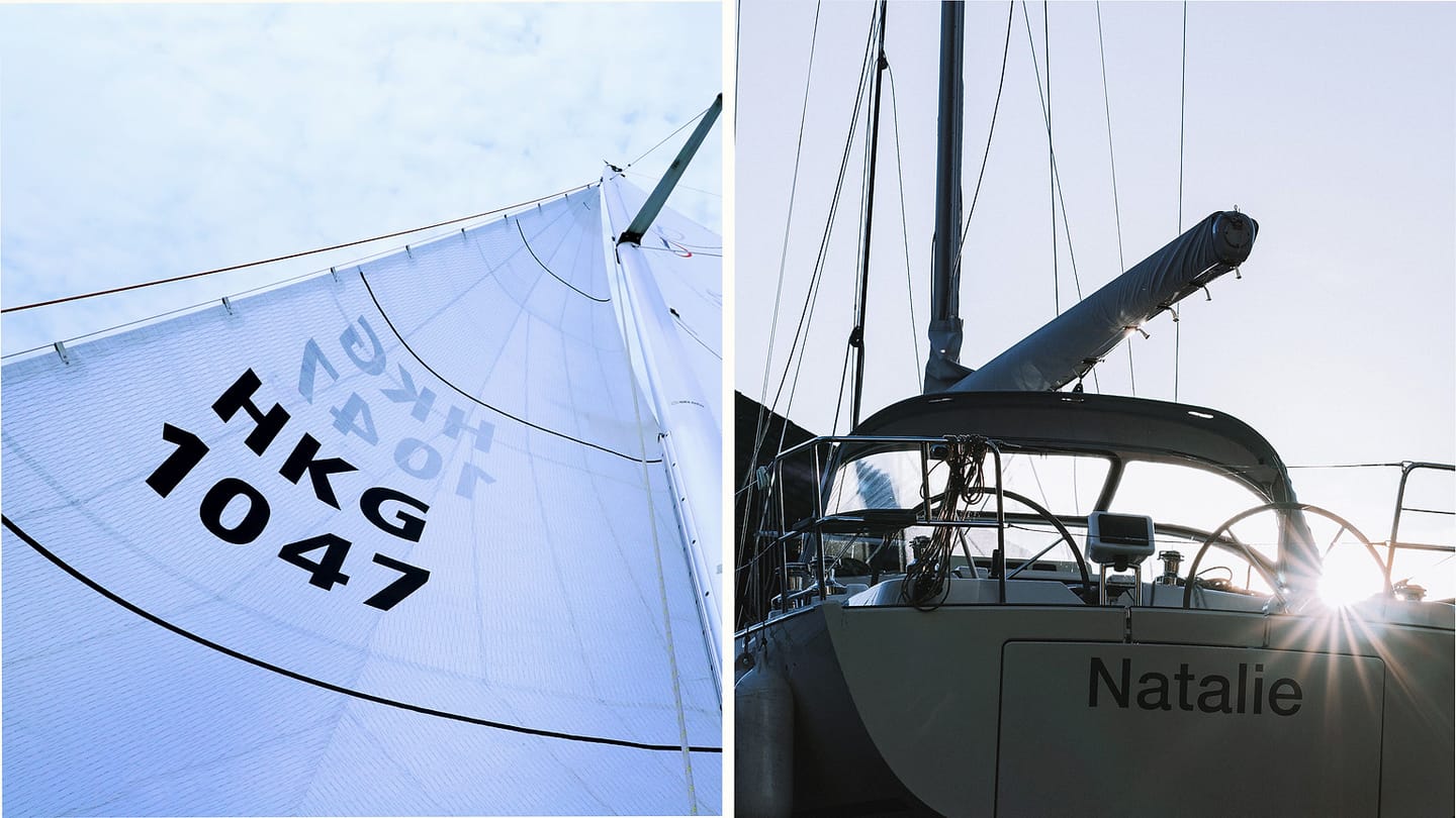 Headsail and docked sloop showing the sail forward of the mast