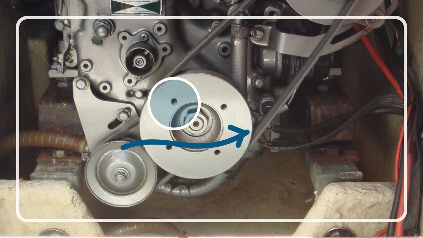 Compact marine diesel engine with hoses and wiring visible