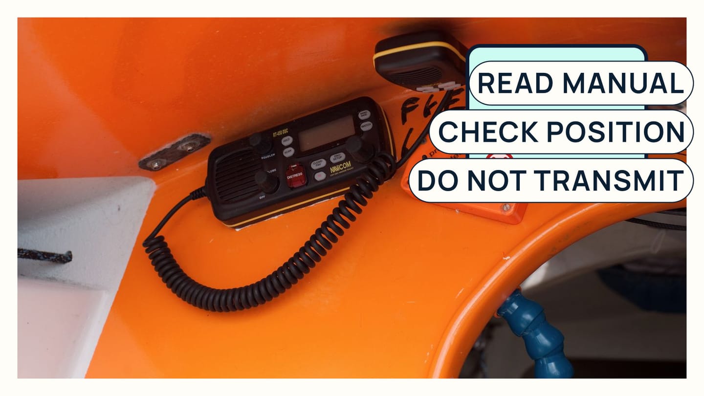 A real VHF display and handset beside a no-transmit practice checklist