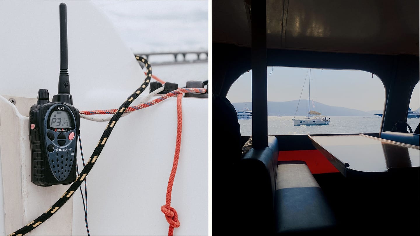 Handheld radio and running rigging in a sailboat cockpit
