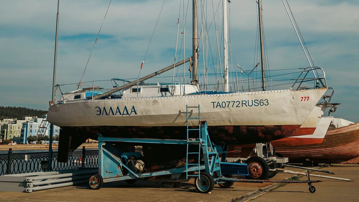 Sailboat standing in a dry boatyard