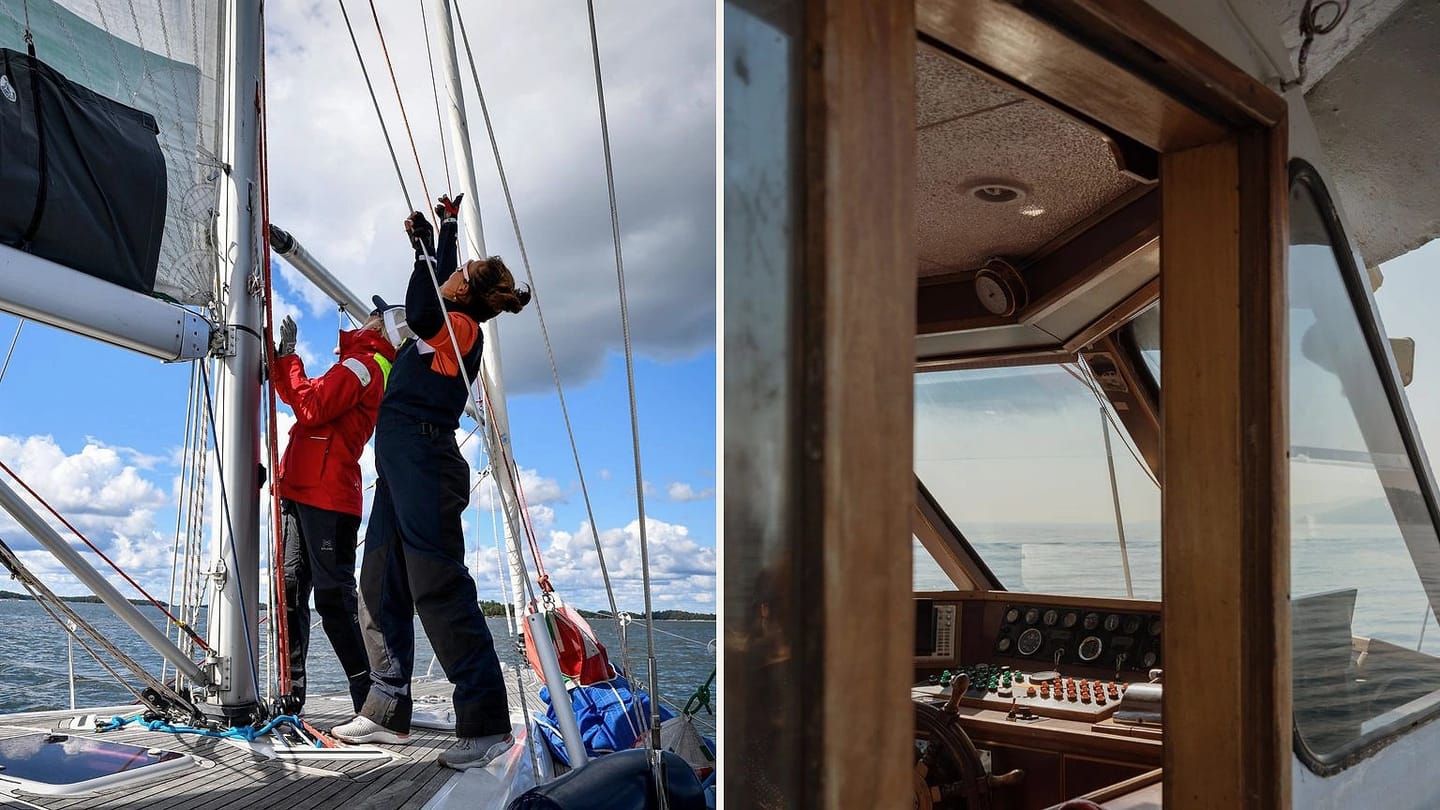 Crew handling sails beside a wooden yacht helm console