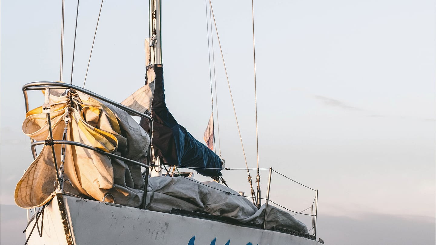 Charter boat in harbour where financial exposure is compared