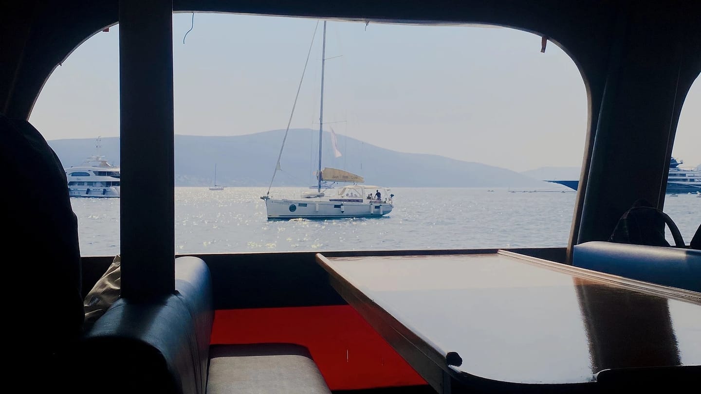 Helm and seating inside a yacht cabin