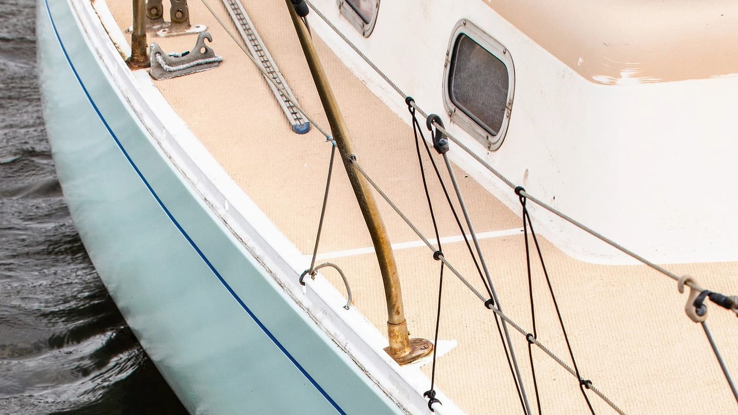 White yacht moored on calm water