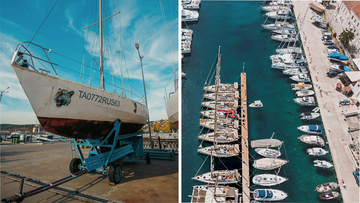 Keelboat ashore beside rows of boats