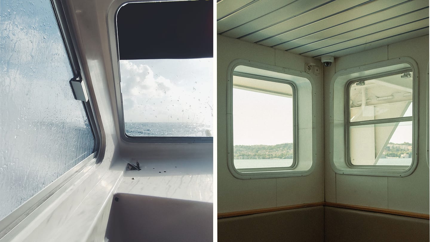 Rainy boat window beside dry cabin seating