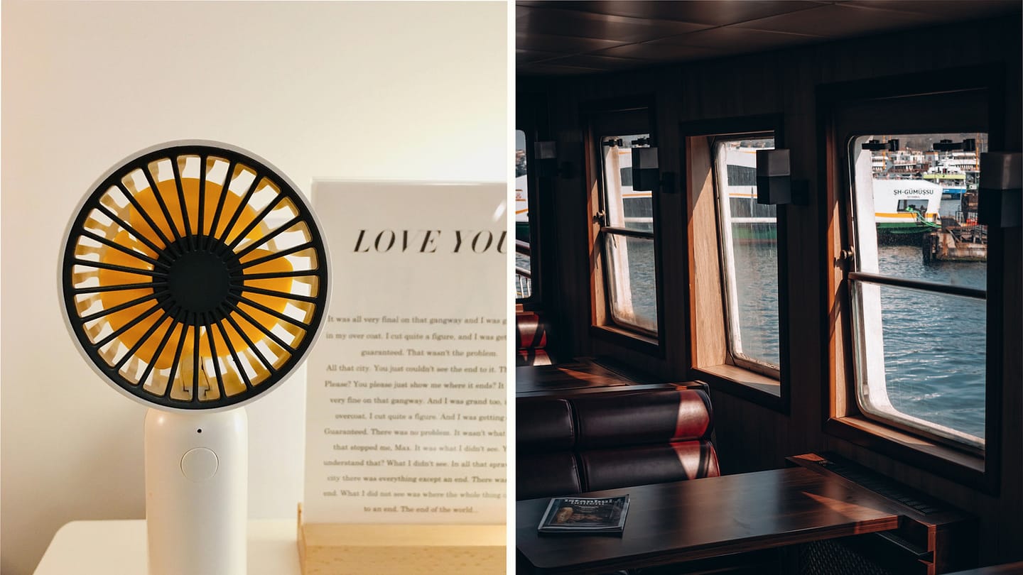 Small electric fan beside boat cabin windows