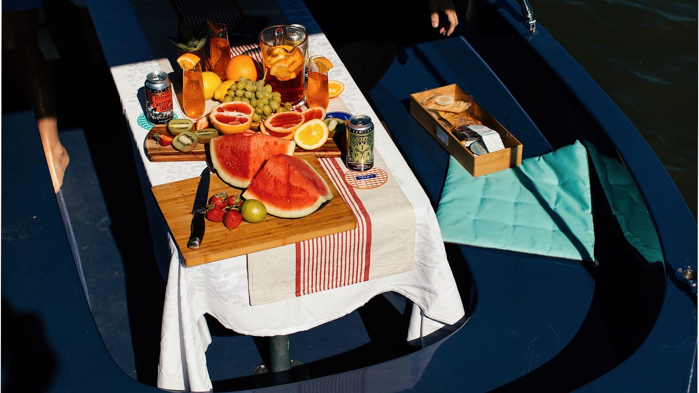 Fresh fruit and drinks arranged on a boat table
