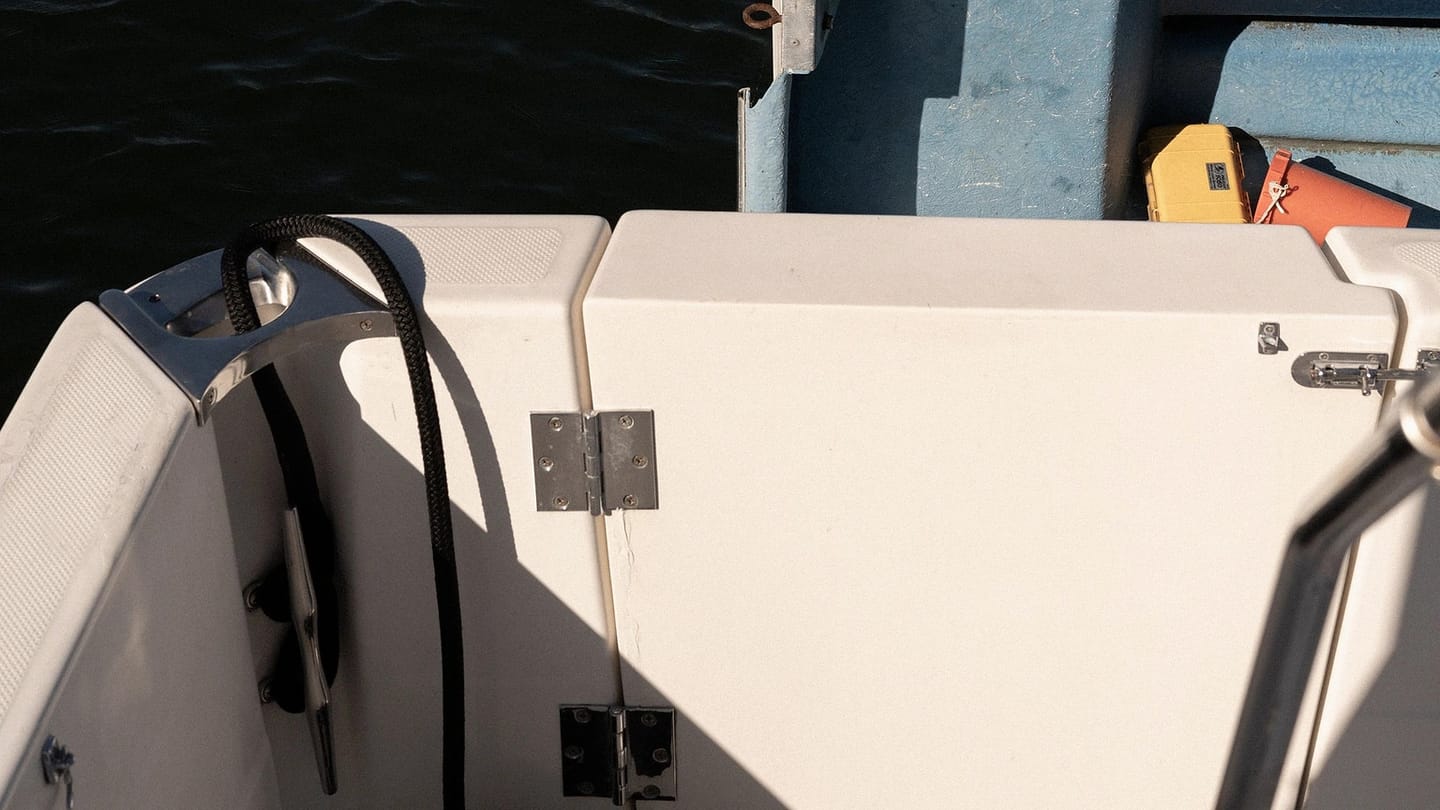 Clean corner of a white boat deck