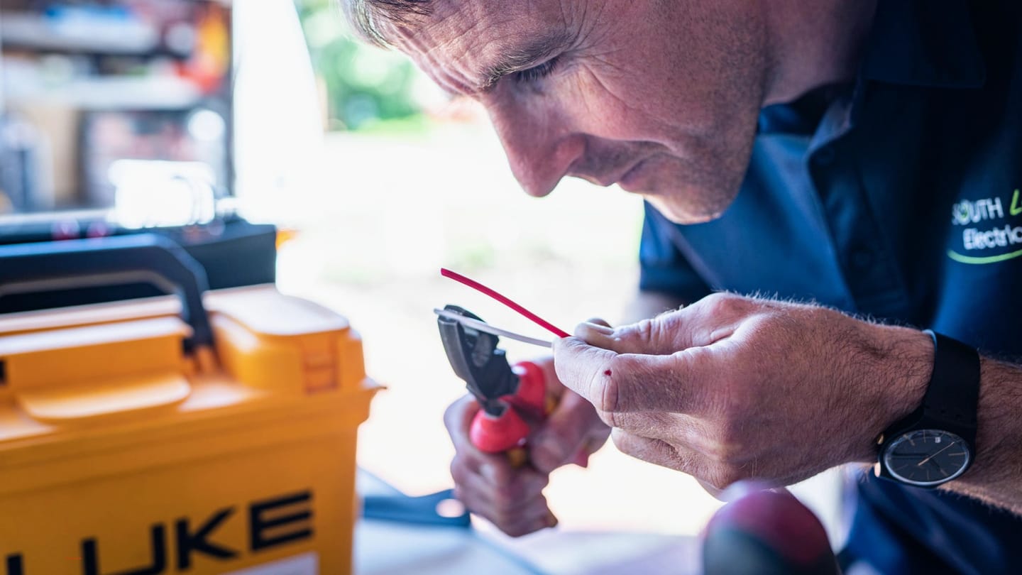 Electrical hand tools and boat-style wiring on a work surface