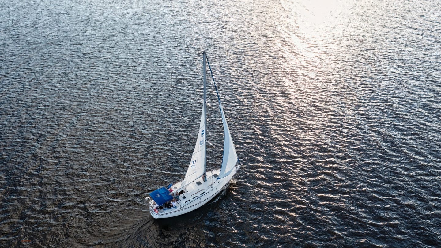 Cruising yacht under sail viewed from directly above