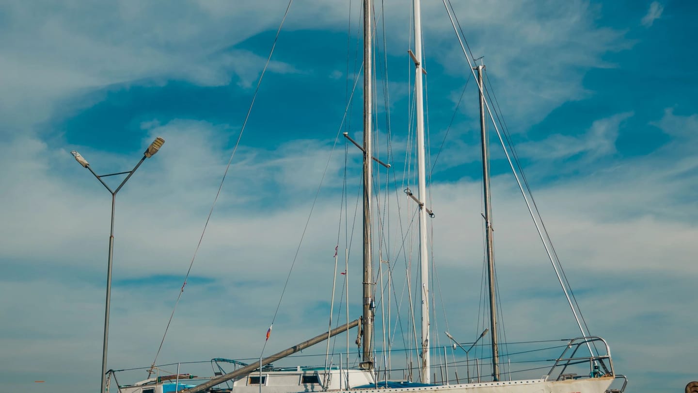 Sailboat standing ashore for inspection of hull and keel