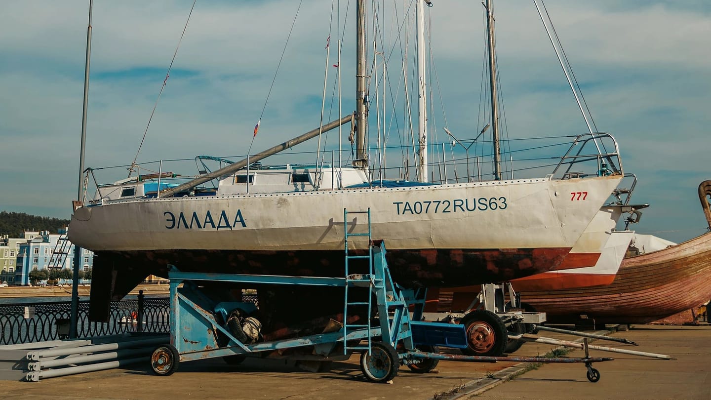 Sailboat standing on supports in a boatyard