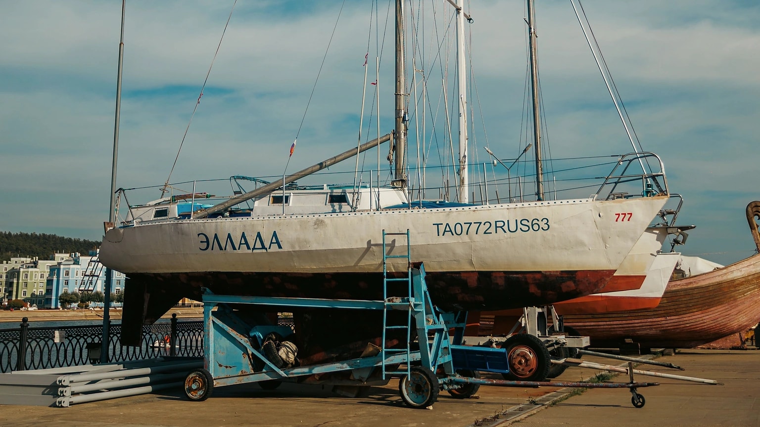 Sailboats standing in a boatyard for inspection and repair