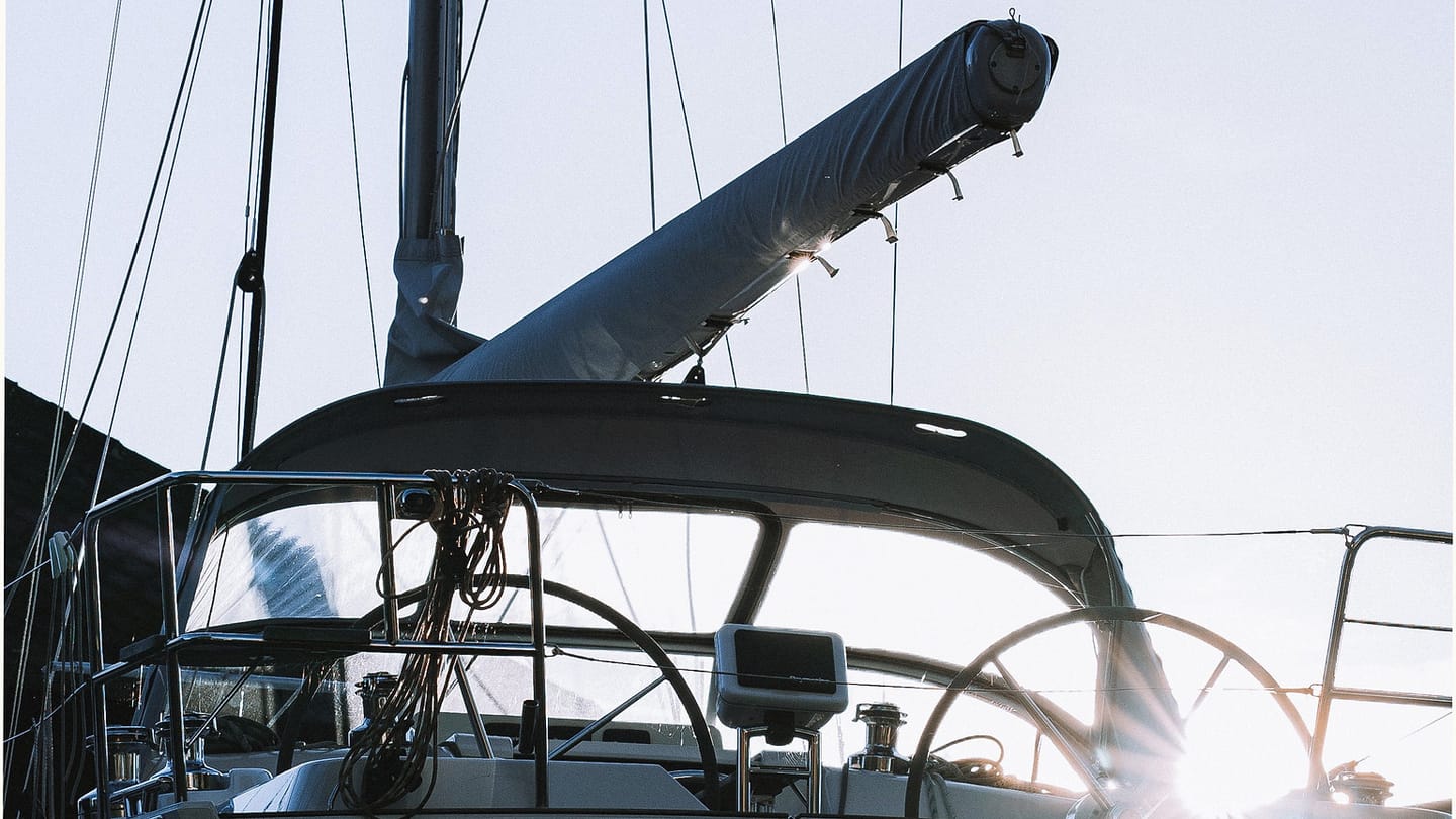 Docked sailboat where the steering compass can be checked