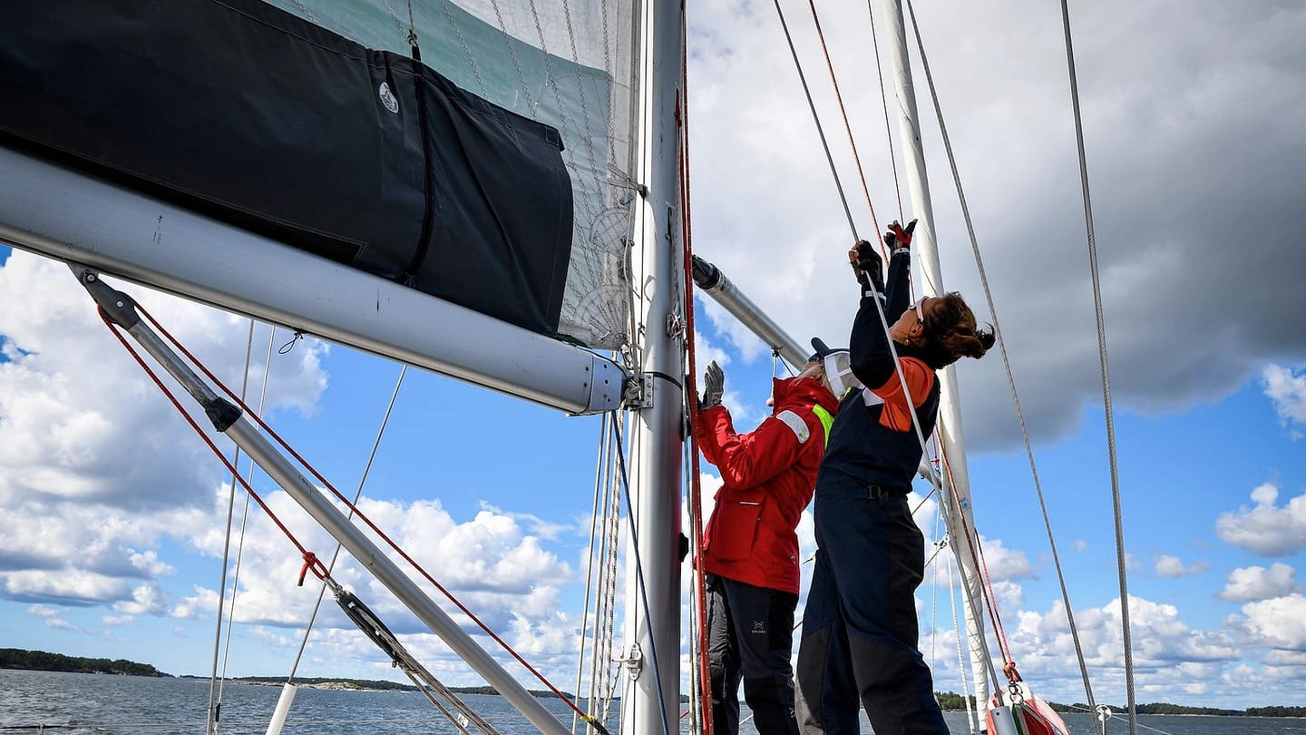 Crew operating a yacht while underway