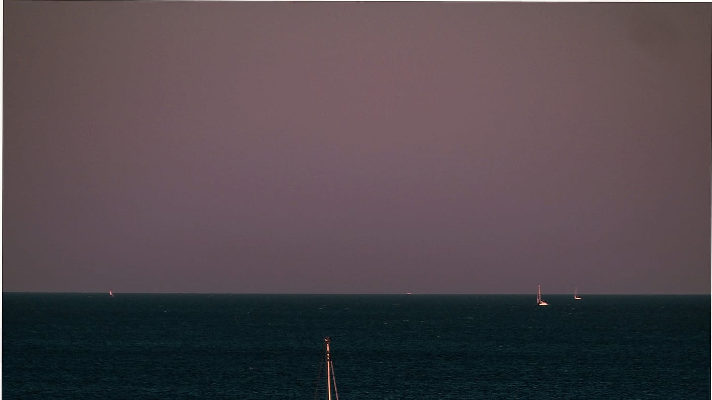 Sailboat close-hauled on open water
