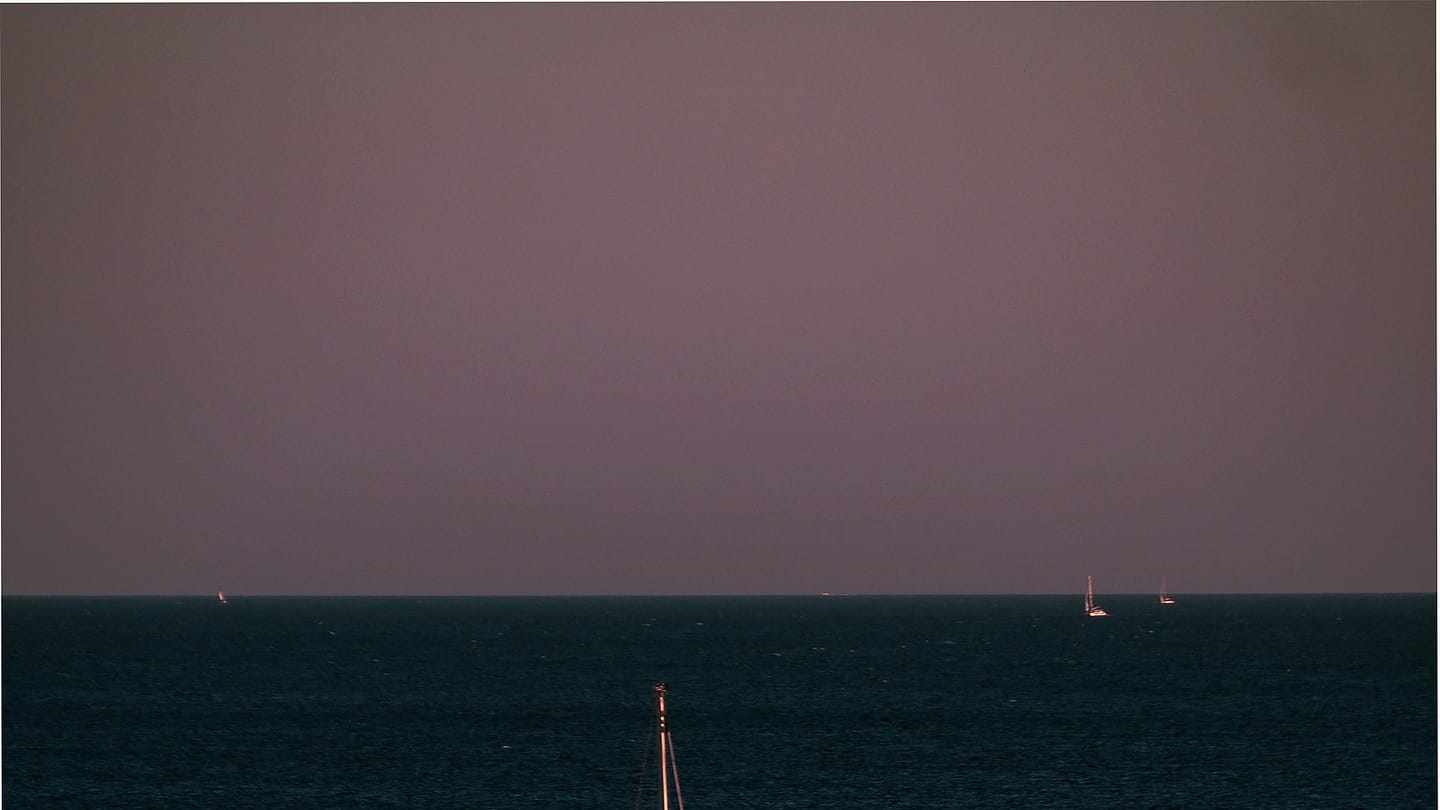 Sailboat moving steadily through open water