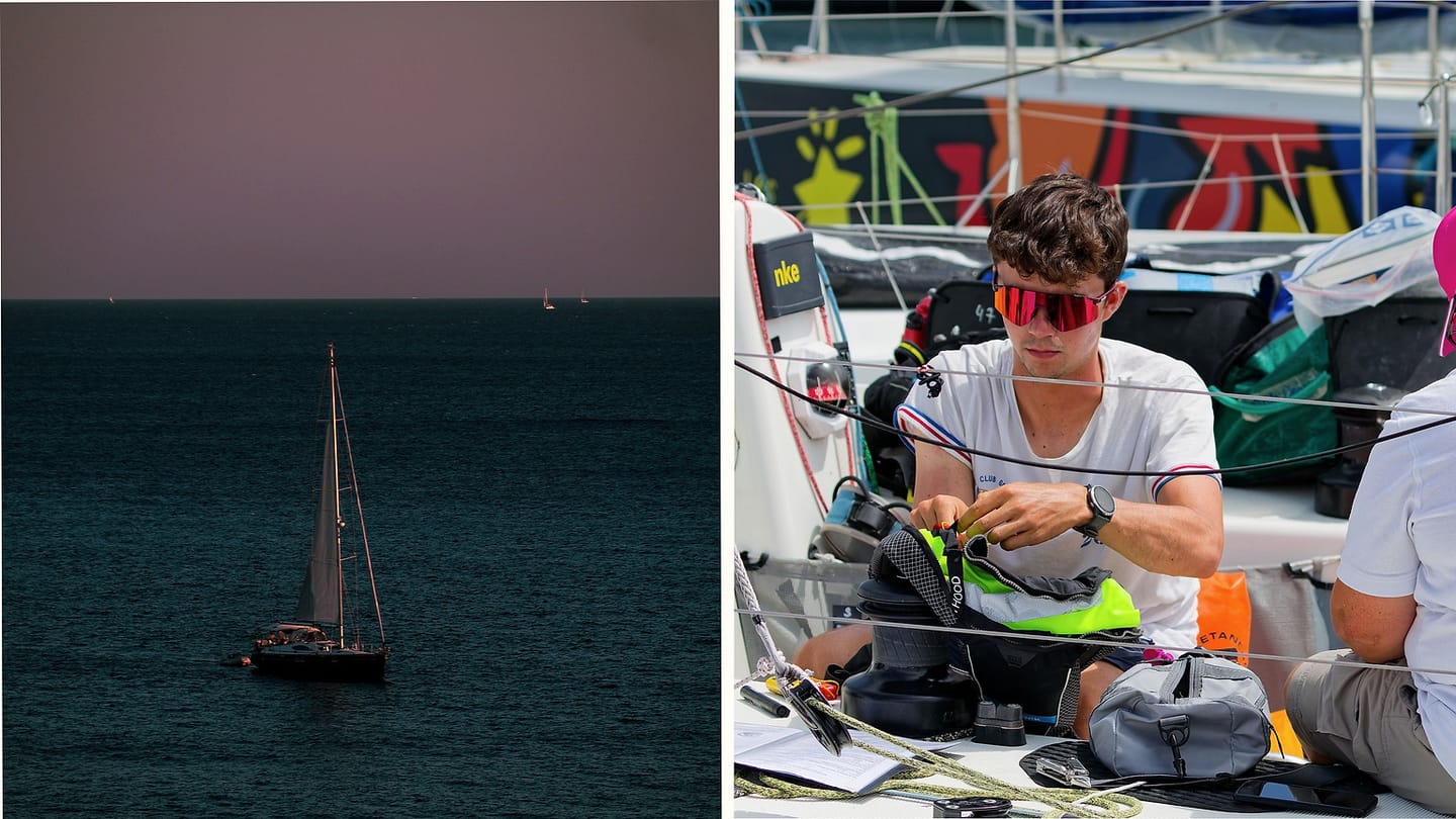 Sailboat and crew observing wind clues